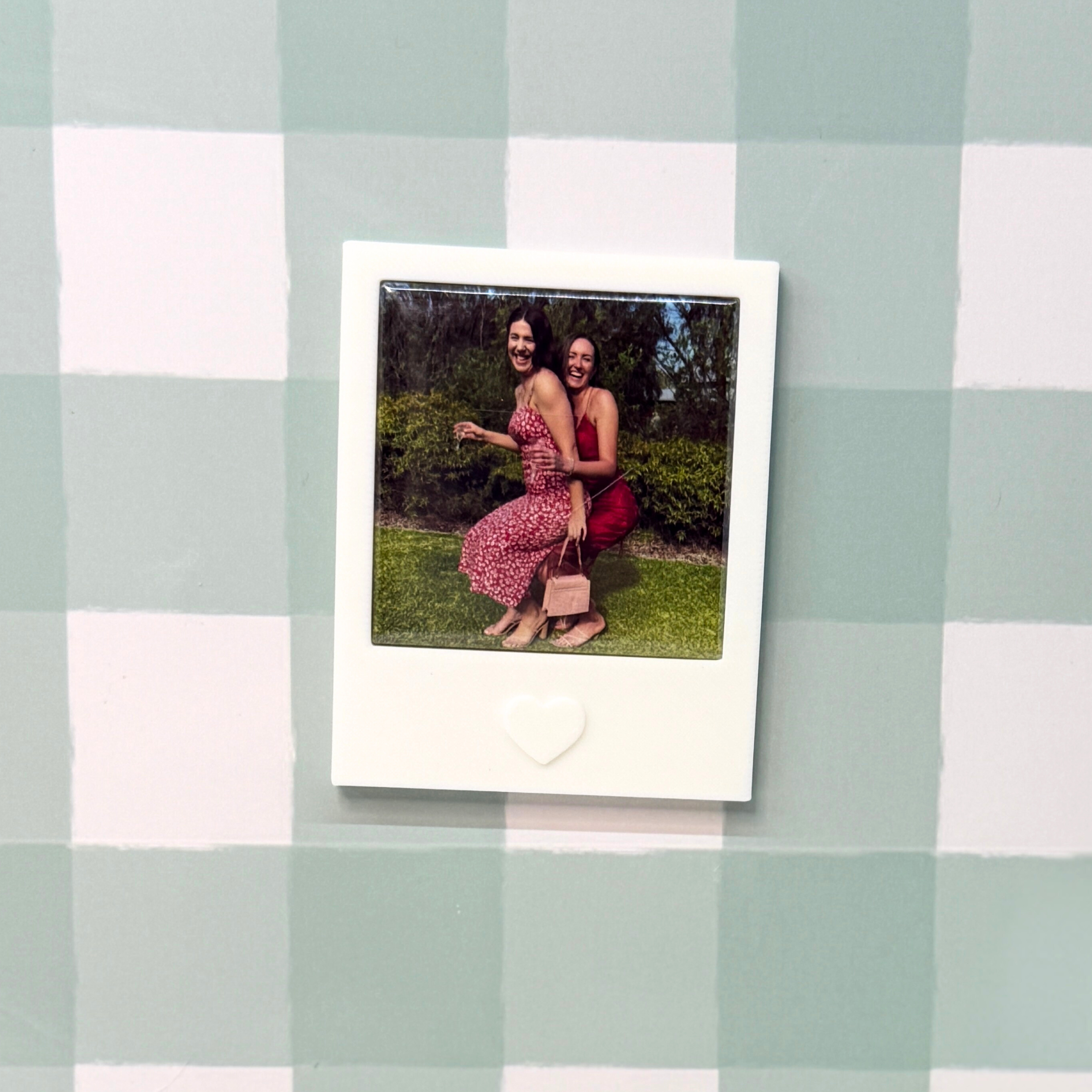 Two girl at a wedding on polaroid photo magnet