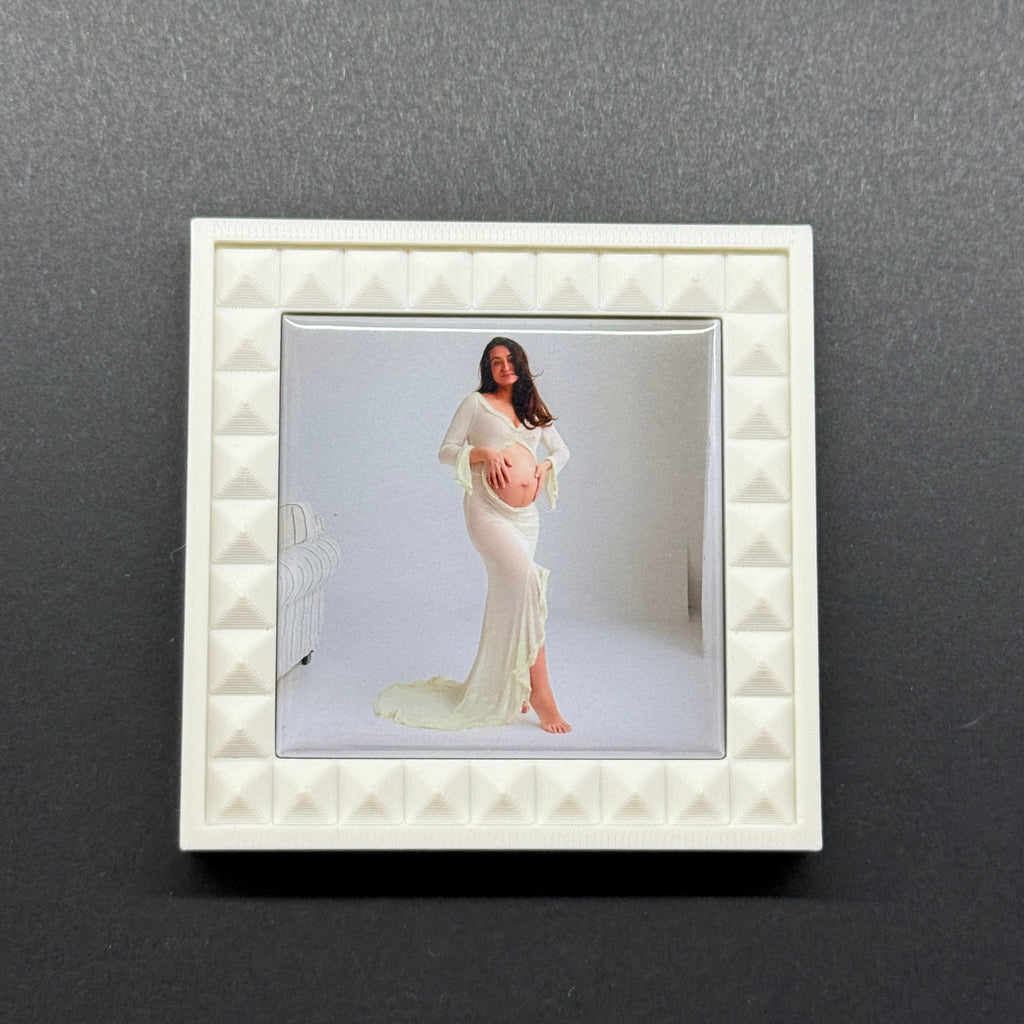 White decorative frame with a photo of a woman on a gray background