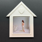 White arrow-shaped photo frame with a picture of a woman on a dark gray background