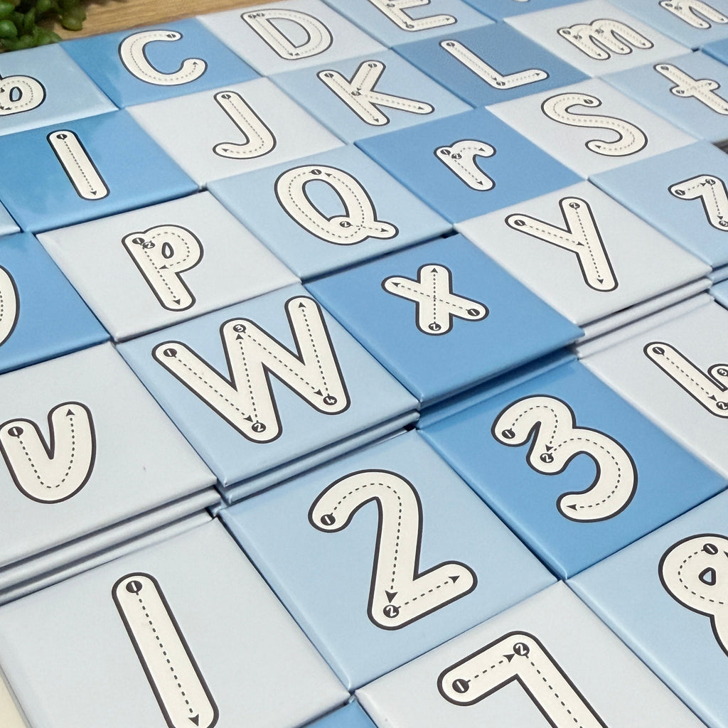 Alphabet blocks with letters on a blue and white checkered background