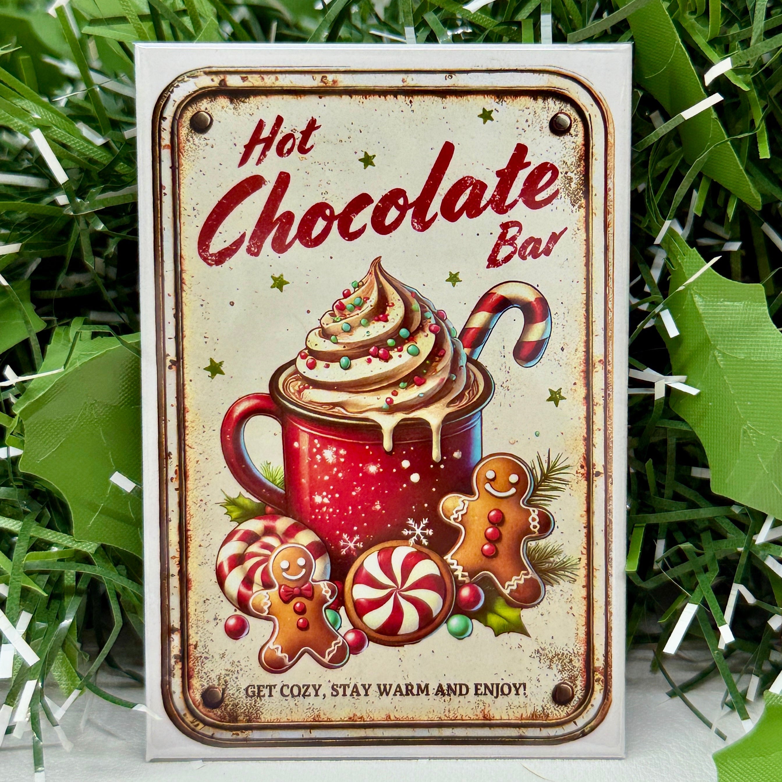 Decorative sign for a hot chocolate bar with festive elements on a grassy background