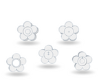 Set of five white flower-shaped earrings on a light gray background